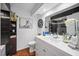 A modern bathroom with vanity, updated toilet, and black-tiled shower offers style and functionality at 1120 N Shore Ne Dr # 802, St Petersburg, FL 33701