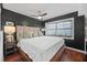 A comfortable main bedroom features a large window, a ceiling fan, and tasteful decor at 1120 N Shore Ne Dr # 802, St Petersburg, FL 33701