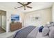 Stylishly furnished bedroom featuring modern decor, wood dresser, and a cozy queen-size bed at 11250 108Th Ln, Largo, FL 33778