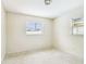 Bedroom featuring terrazzo flooring, natural light, and bright neutral wall color at 11250 108Th Ln, Largo, FL 33778