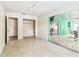 Bonus room with terrazzo floors, closet, and sliding doors leading to a sunroom at 11250 108Th Ln, Largo, FL 33778