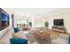 Spacious living room with plush furniture, stylish decor, and open floor plan for comfortable living and entertaining at 11250 108Th Ln, Largo, FL 33778