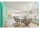 Enclosed patio with tiled floor and outdoor table and chairs at 11250 108Th Ln, Largo, FL 33778