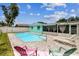 A clean pool, set within a patio, promises outdoor leisure and relaxation at 11250 108Th Ln, Largo, FL 33778
