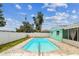 The outdoor pool area with the deck provides a beautiful space for recreation and relaxation at 11250 108Th Ln, Largo, FL 33778