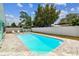 Backyard features a refreshing in-ground pool, perfect for relaxing and enjoying the outdoors at 11250 108Th Ln, Largo, FL 33778