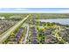 Picture of community featuring beautiful homes and a lake, with lush green landscaping at 11419 Emerald Shore Dr, Riverview, FL 33579