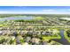Picture of community featuring beautiful homes, a lake, and a location pin on a roof at 11419 Emerald Shore Dr, Riverview, FL 33579