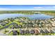 Picture of homes and a lake surrounded by green landscaping at 11419 Emerald Shore Dr, Riverview, FL 33579