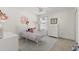 Bright bedroom with plush carpeting and featuring light neutral walls and a soft color palette at 11419 Emerald Shore Dr, Riverview, FL 33579