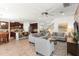 Open-concept living room blending seamlessly with the kitchen and dining area at 11419 Emerald Shore Dr, Riverview, FL 33579