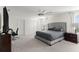 Spacious primary bedroom with carpet, neutral decor, and a ceiling fan at 11419 Emerald Shore Dr, Riverview, FL 33579