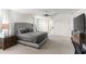 Spacious main bedroom features neutral colors, ceiling fan and a large window that offers plenty of natural light at 11419 Emerald Shore Dr, Riverview, FL 33579
