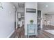 Bright hallway leads to kitchen and living areas with a stylish decor at 11520 Bear Paw Ln, Port Richey, FL 34668
