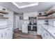 Bright, updated kitchen with stainless steel appliances and sleek countertops at 11520 Bear Paw Ln, Port Richey, FL 34668