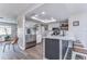 Modern kitchen with stainless steel appliances, island, and skylight at 11520 Bear Paw Ln, Port Richey, FL 34668