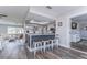 Modern kitchen with island seating, stainless steel appliances, and skylight at 11520 Bear Paw Ln, Port Richey, FL 34668