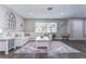 Spacious living room with stylish décor, wood floors, and lots of natural light at 11520 Bear Paw Ln, Port Richey, FL 34668