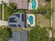 Aerial view of a home featuring a pool, patio, and solar panels on the roof at 1213 Barmere Ln, Brandon, FL 33511