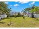 Well-manicured backyard showcasing a lush lawn, storage shed, and privacy fence, ideal for outdoor activities and relaxation at 1213 Barmere Ln, Brandon, FL 33511