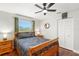 Comfortable bedroom features a ceiling fan, a window, wood floors, and a closet at 1213 Barmere Ln, Brandon, FL 33511