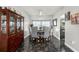 Dining room featuring a round table, upholstered chairs, display cabinet, and tile flooring at 1213 Barmere Ln, Brandon, FL 33511
