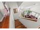Inviting entryway features wood stairs, a view of the living room with a soaring ceiling and large windows at 1213 Barmere Ln, Brandon, FL 33511