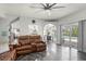 Open-concept living room showcasing pool views, tile floors, and seamless indoor-outdoor flow at 1213 Barmere Ln, Brandon, FL 33511