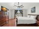Bright primary bedroom with a ceiling fan, vaulted ceiling, a view to the outside, and ample closet space at 1213 Barmere Ln, Brandon, FL 33511