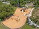 Community playground with slides, swings and wood chip base at 1213 Barmere Ln, Brandon, FL 33511
