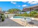 Outdoor pool area with an umbrella and plenty of seating, perfect for entertaining at 1213 Barmere Ln, Brandon, FL 33511