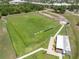 Aerial view of a community soccer field with a building with an overhang at 1213 Barmere Ln, Brandon, FL 33511