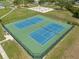 Aerial view of a community tennis court with a fence at 1213 Barmere Ln, Brandon, FL 33511