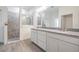 Bathroom features a walk-in shower, granite countertops, double sinks, and tile floors at 12420 Brick Cobblestone Dr, Riverview, FL 33579