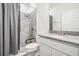 Clean bathroom with granite countertop, handicap bar and tiled shower at 12420 Brick Cobblestone Dr, Riverview, FL 33579