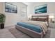 Bedroom with ocean themed decor, plush bedding and a large accent rug at 12420 Brick Cobblestone Dr, Riverview, FL 33579
