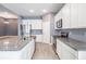 Spacious kitchen with stainless steel appliances, granite countertops, and white cabinetry, perfect for cooking at 12420 Brick Cobblestone Dr, Riverview, FL 33579