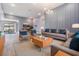 Staged living room with modern furniture, stylish decor, and recessed lighting at 12420 Brick Cobblestone Dr, Riverview, FL 33579