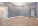 The spacious living room features decorative wall paneling and sleek tile flooring at 12420 Brick Cobblestone Dr, Riverview, FL 33579