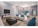 Inviting living room featuring neutral furniture, recessed lighting, and wood-look tile floors at 12420 Brick Cobblestone Dr, Riverview, FL 33579
