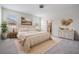The bedroom features neutral colors and natural light from the two windows at 12420 Brick Cobblestone Dr, Riverview, FL 33579