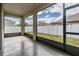 Screened patio with views of fenced backyard at 12420 Brick Cobblestone Dr, Riverview, FL 33579