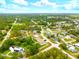 An aerial view of a neighborhood with lots of trees and well-maintained homes at 13216 Antelope St, Spring Hill, FL 34609