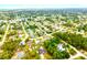 An aerial view of a neighborhood with lots of trees and well-maintained homes at 13216 Antelope St, Spring Hill, FL 34609