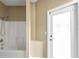 Bathroom featuring tub shower combination and doorway to enclosed patio at 13216 Antelope St, Spring Hill, FL 34609