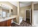 Bathroom featuring double vanity, a soaking tub, and a walk-in shower at 13216 Antelope St, Spring Hill, FL 34609