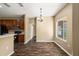 Dining room featuring a modern chandelier and dark wood floors at 13216 Antelope St, Spring Hill, FL 34609