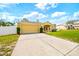 Charming single-story home featuring an attached garage, well-manicured lawn, and inviting curb appeal at 13216 Antelope St, Spring Hill, FL 34609