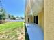 Exterior view showing a well-maintained home with green lawn and covered porch at 13216 Antelope St, Spring Hill, FL 34609