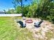 A backyard fire pit with Adirondack chairs perfect for outdoor entertaining at 13216 Antelope St, Spring Hill, FL 34609